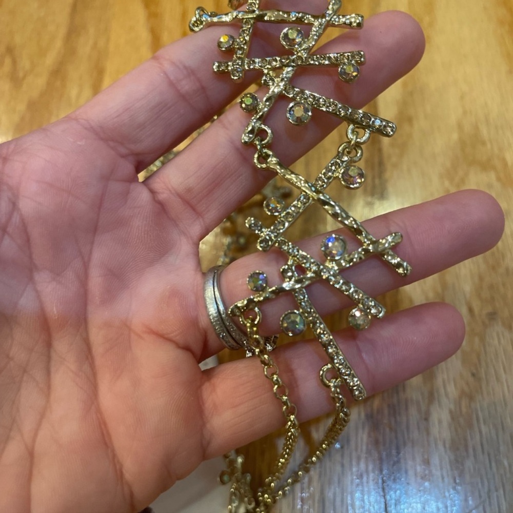Tint gold diamond studded cross cross necklace and earring set